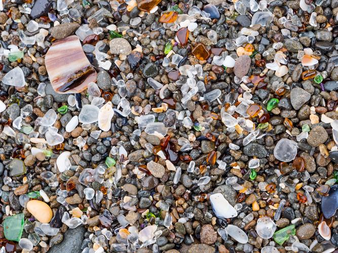 Section of beach with glass among stones Section of beach with glass among stones