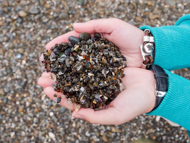 Handful of pebbles mixed with glass Handful of pebbles mixed with glass