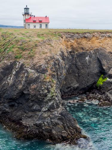 View of lighthouse on rocks View of lighthouse on rocks